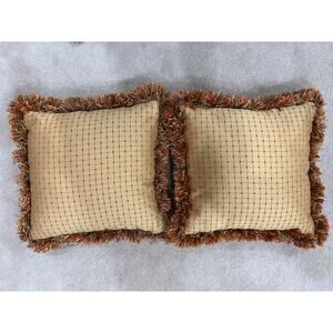 Pair of grid or checkpattern throw pillows orange brown gold